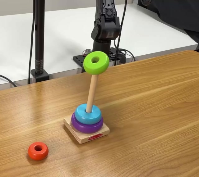 Actual failure state: a green ring is tilted and caught near the top of the peg.